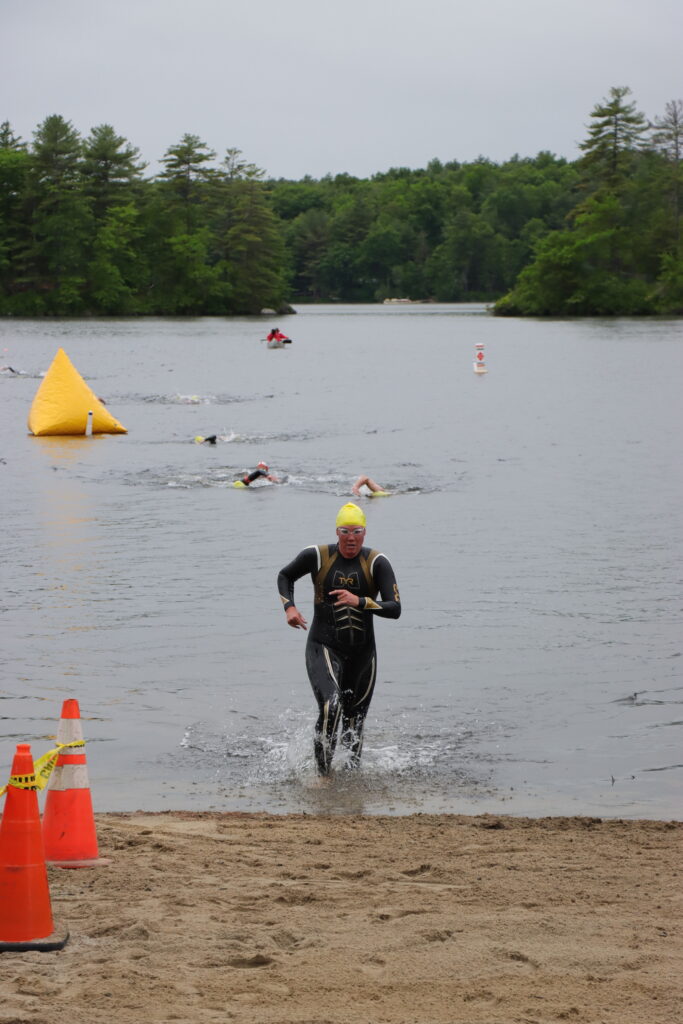 swimmer running out pond