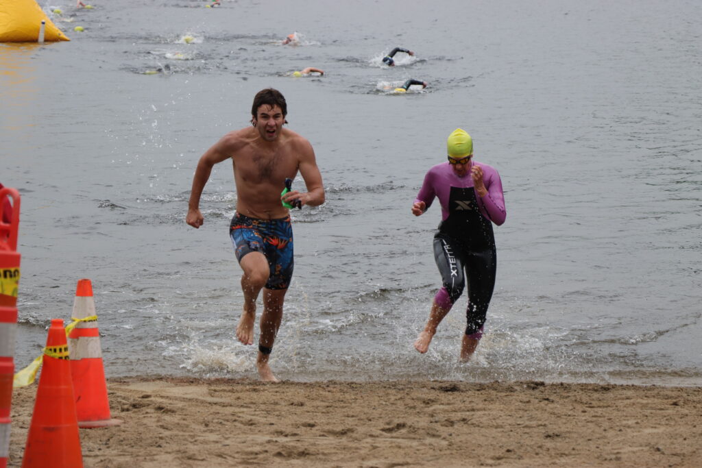 swimmers running out of pond
