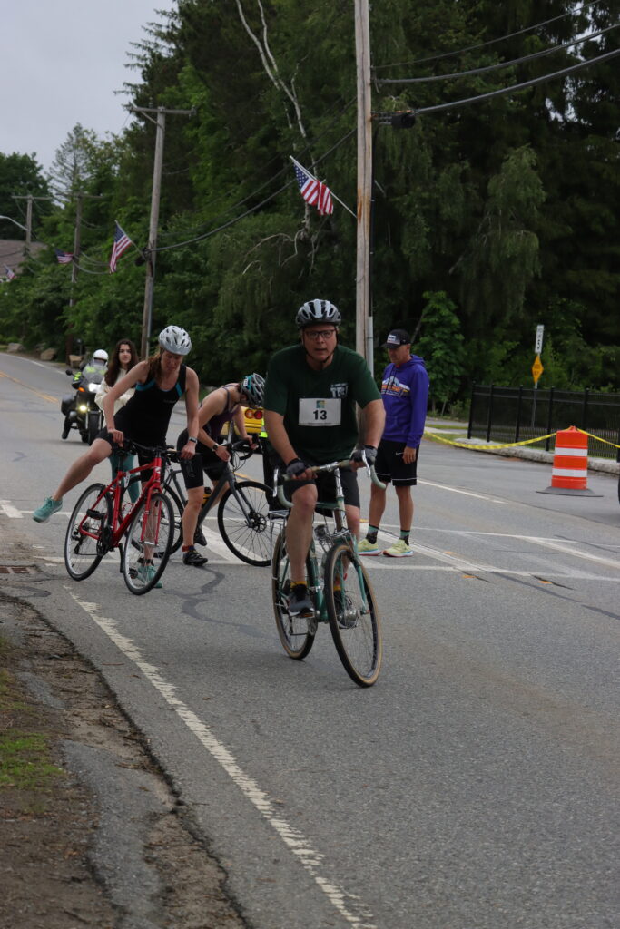 contestants getting on bikes